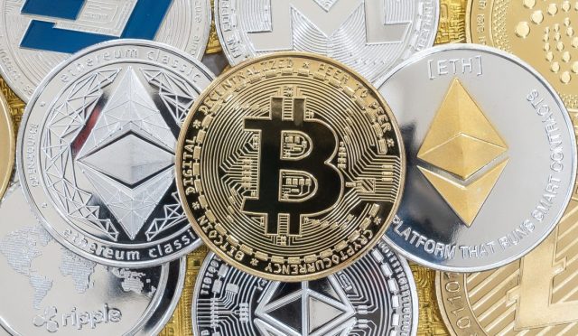 Bangkok, Thailand - 16 April 2021: Cryptocurrency on Binance trading app, Bitcoin BTC with altcoin digital coin crypto currency, BNB, Ethereum, Dogecoin, Cardano, defi p2p decentralized fintech market